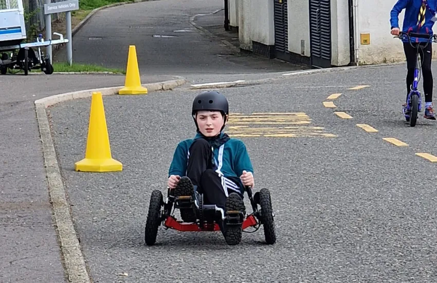 male scout on a go cart