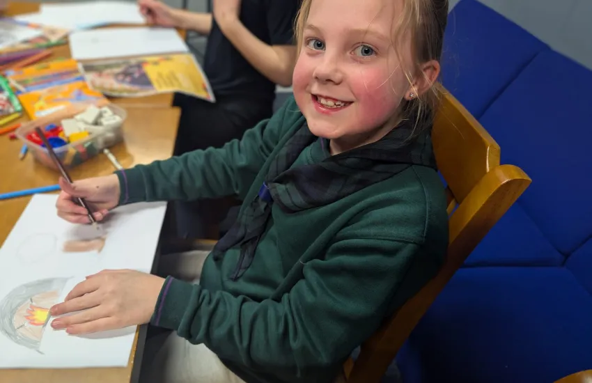 A cub making a poster