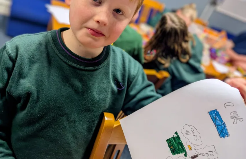 A cub displaying his poster