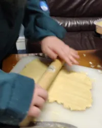 A scout rolling out shortbread
