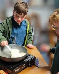 Cubs and scouts making pancakes