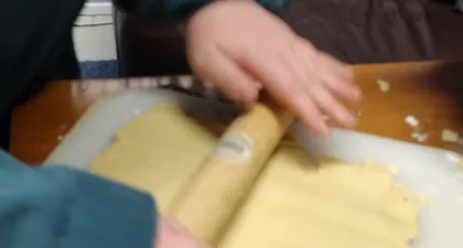 A scout rolling out shortbread