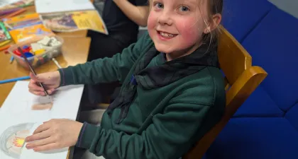 A cub making a poster